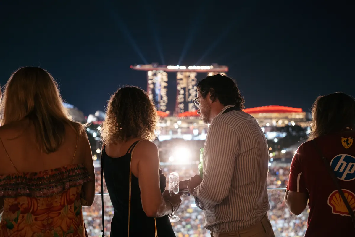 Guests watching the light show over Marina Bay from the 47A® terrace